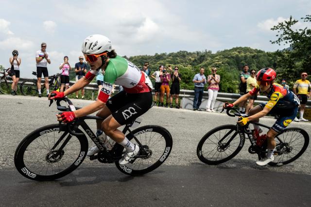 UAE Italian rider Elisa Longo Borghini and Lidl Trek Canadian rider Isabella Holmgren (R) ride during the 9th stage of the Giro d'Italia Women 2026 - Tour of Italy Women cycling race between Saluzzo and Saluzzo, Italy, on June 7, 2026. (Photo by MARCO BERTORELLO / AFP)