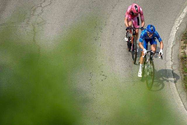 SD Worx Dutch rider Anna Van Der Breggen wearing the overall leader's pink jersey (Maglia Rosa) and FDJ SUEZ Dutch rider Demi Vollering wearing the best climber's blue jersey (Maglia Azzura) ride during the 9th stage of the Giro d'Italia Women 2026 - Tour of Italy Women cycling race between Saluzzo and Saluzzo, Italy, on June 7, 2026. (Photo by MARCO BERTORELLO / AFP)