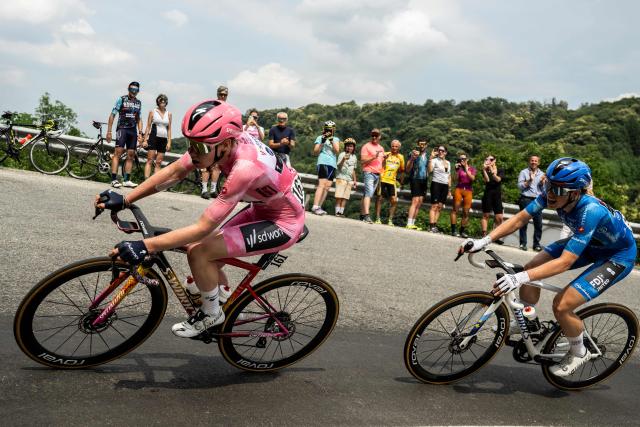 (LtoR) SD Worx-Protime's Dutch cyclist Anna van der Breggen, wearing the overall leader's pink jersey (Maglia Rosa), and FDJ Suez's Dutch cyclist Demi Vollering, wearing the best climber's blue jersey (Maglia Azzurra), ride during the 9th stage of the Giro d'Italia Women 2026 between Saluzzo and Saluzzo in Saluzzo on June 7, 2026. (Photo by MARCO BERTORELLO / AFP)