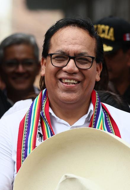 Peru's presidential candidate Roberto Sanchez, for the Juntos por el Peru party, gestures as he leaves after an election-day breakfast in Huaral, Lima department, Peru on June 7, 2026. Peruvians will choose their ninth president in 10 years in a tight runoff election between conservative Keiko Fujimori and leftist Roberto Sanchez, who are trying to woo voters fed up with political chaos and rising crime. (Photo by Connie FRANCE / AFP)