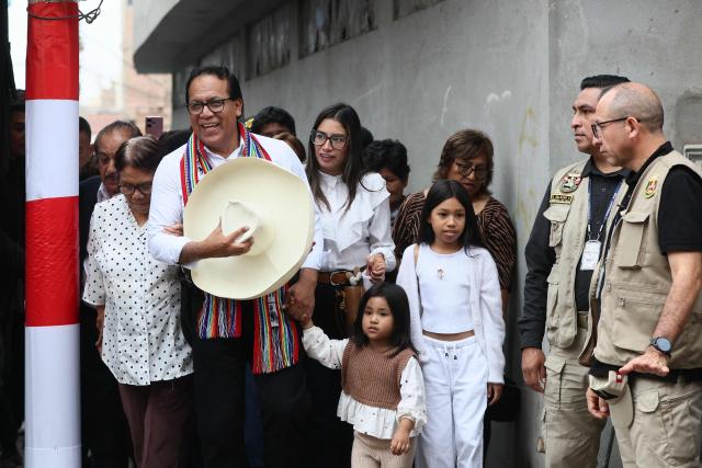 Peru's presidential candidate Roberto Sanchez, for the Juntos por el Peru party, leaves with his wife Claudia Pinazzo, their daughters Killa and Qorianka, and his parents after an election-day breakfast in Huaral, Lima department, Peru on June 7, 2026. Peruvians will choose their ninth president in 10 years in a tight runoff election between conservative Keiko Fujimori and leftist Roberto Sanchez, who are trying to woo voters fed up with political chaos and rising crime. (Photo by Connie FRANCE / AFP)