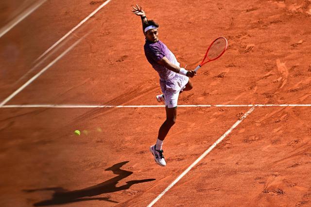 Italy's Flavio Cobolli plays a backhand return to Germany's Alexander Zverev during their men's final singles match on day 15 of the French Open tennis tournament on Court Philippe-Chatrier at the Roland-Garros Complex in Paris on June 7, 2026. (Photo by JULIEN DE ROSA / AFP)