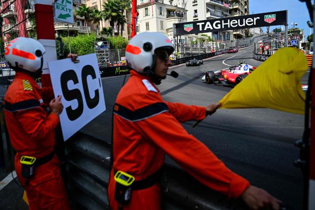 Mercedes' Italian driver Kimi Antonelli (C) and Ferrari's British driver Lewis Hamilton (R) follow the safety car during Monaco Formula 1 Grand Prix at the Monaco street circuit in Monaco, ahead of the, on June 7, 2026. (Photo by Andrej ISAKOVIC / AFP)
