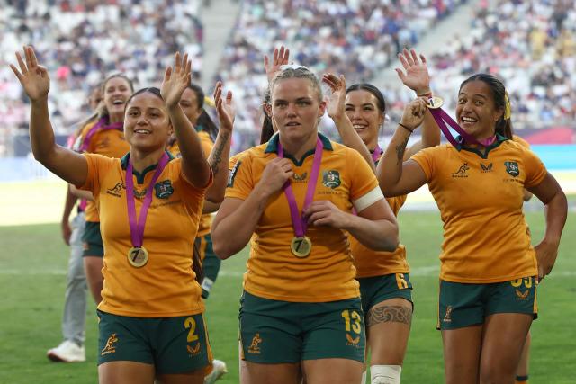 Australia's players celebrate at the end of the HSBC SVNS World Championship women's rugby union sevens final match between New Zealand and Australia at the Atlantique Bordeaux Metropole Stadium in Bordeaux, southwestern France, on June 7, 2026. (Photo by ROMAIN PERROCHEAU / AFP)