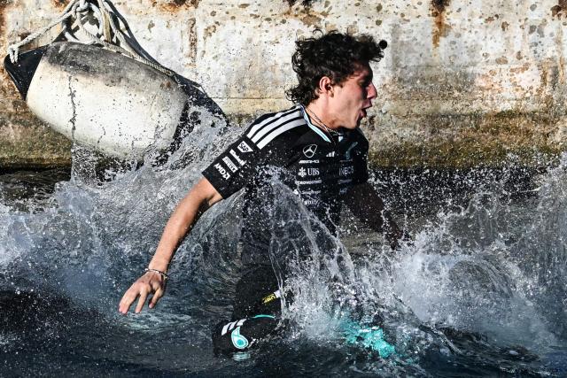 Winner Mercedes' Italian driver Kimi Antonelli jumps in the sea after winning the Monaco Formula 1 Grand Prix at the Monaco street circuit in Monaco, ahead of the, on June 7, 2026. (Photo by Gabriel BOUYS / AFP)