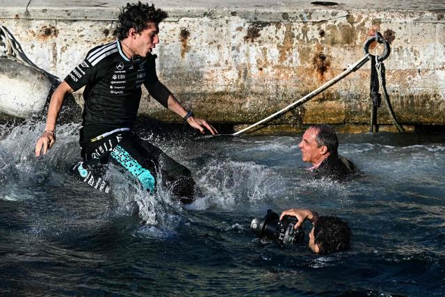 Winner Mercedes' Italian driver Kimi Antonelli jumps in the sea after winning the Monaco Formula 1 Grand Prix at the Monaco street circuit in Monaco, ahead of the, on June 7, 2026. (Photo by Gabriel BOUYS / AFP)
