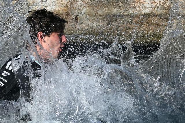 Winner Mercedes' Italian driver Kimi Antonelli jumps in the sea after winning the Monaco Formula 1 Grand Prix at the Monaco street circuit in Monaco, ahead of the, on June 7, 2026. (Photo by Gabriel BOUYS / AFP)