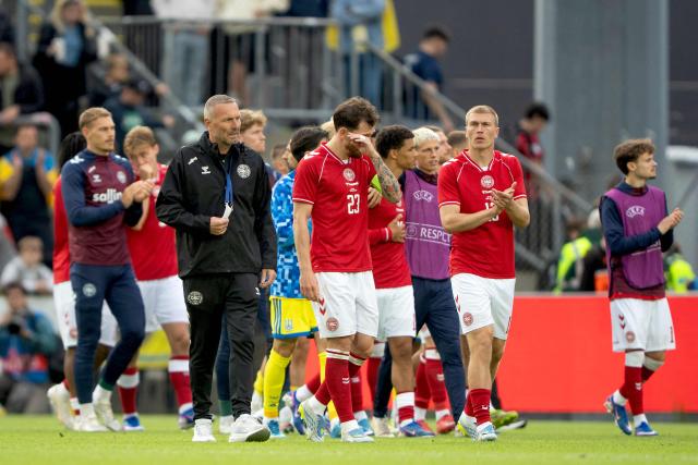 Denmark's midfielder #23 Pierre-Emile Hojbjerg (C), Denmark's defender Rasmus Nissen Kristensen (R) react after Christian Eriksen was taken away in an ambulance following his collapse during the football international friendly match between Denmark and Ukraine at Odense Stadium in Denmark, on June 7, 2026. Christian Eriksen collapsed during Denmark's friendly against Ukraine on June 7, 2026, five years after he suffered a cardiac arrest during the European Championships. (Photo by Bo Amstrup / AFP) / Denmark OUT