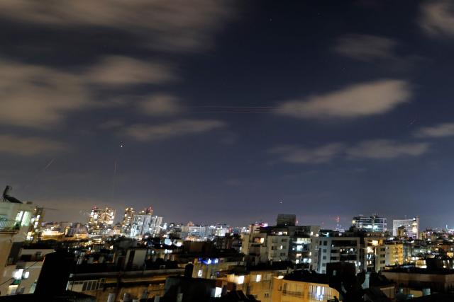 Rocket trails are seen in the sky above the Israeli coastal city of Netanya on June 7, 2026. Air raid sirens sounded in Israel on June 8 as its military worked to intercept barrages of incoming Iranian missiles for the first time since an April ceasefire took hold in the Middle East war. (Photo by JACK GUEZ / AFP) / 