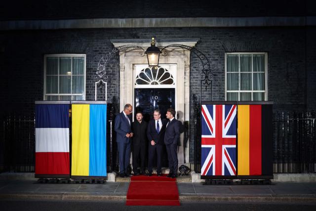 (L to R) Germany's Chancellor Friedrich Merz, Ukraine's President Volodymyr Zelensky, Britain's Prime Minister Keir Starmer and France's President Emmanuel Macron chat on the 10 Downing Street doorstep after a meeting in central London on June 7, 2026. (Photo by Henry Nicholls / AFP)