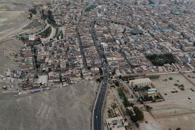 This aerial view shows the Barbadillo prison, where former Peruvian President Pedro Castillo is being held, during the presidential runoff election in Lima on June 7, 2026. Peruvians will choose their ninth president in 10 years, in a tight runoff election between conservative Keiko Fujimori and leftist Roberto Sanchez who are trying to woo voters fed up with political chaos and rising crime. (Photo by Ernesto BENAVIDES / AFP)