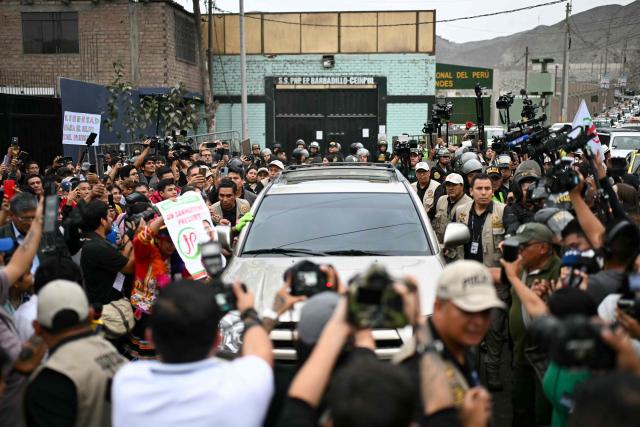 A car carrying Peruvian presidential candidate Roberto Sanchez leaves the Barbadillo prison, where former president Pedro Castillo is being held, during the presidential runoff election in Lima on June 7, 2026. Peruvians will choose their ninth president in 10 years, in a tight runoff election between conservative Keiko Fujimori and leftist Roberto Sanchez who are trying to woo voters fed up with political chaos and rising crime. (Photo by ERNESTO BENAVIDES / AFP)