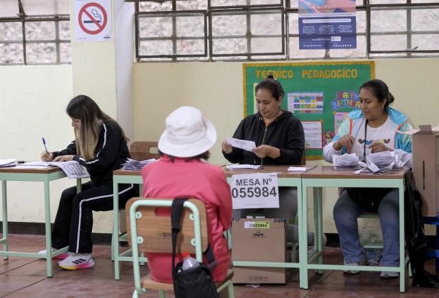 Peruvian election officials count votes during the presidential election runoff at a polling station in San Juan de Lurigancho district, province of Lima, Peru on June 7, 2026. Peruvians will choose their ninth president in 10 years, in a tight runoff election between conservative Keiko Fujimori and leftist Roberto Sanchez who are trying to woo voters fed up with political chaos and rising crime. (Photo by Anthony Nino de Guzman / AFP)