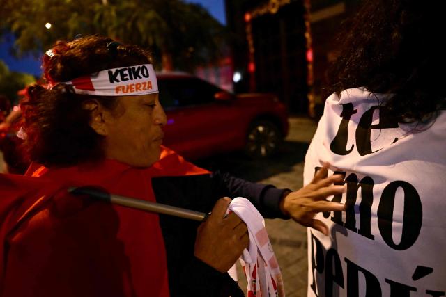 A supporter of Peru's presidential candidate Keiko Fujimori, for the Fuerza Popular party, wears a headband supporting her during the presidential election runoff in Lima on June 7, 2026. Peruvians will choose their ninth president in 10 years in a tight runoff election between conservative Keiko Fujimori and leftist Roberto Sanchez, who are trying to woo voters fed up with political chaos and rising crime. (Photo by MARTIN BERNETTI / AFP)