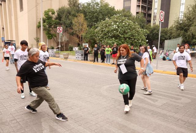 Relatives of missing persons from the collective United Forces for the Disappeared of Nuevo Leon, FUNDENL, play football during a protest called 'Wear the shirt for the disappeared' in Monterrey, Nuevo Leon, Mexico on June 6, 2026. (Photo by Julio Cesar AGUILAR / AFP)