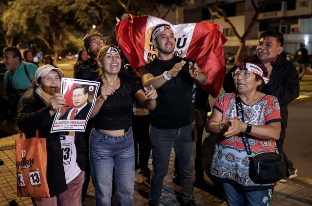 Supporter of Peru's presidential candidate Keiko Fujimori, for the Fuerza Popular party, shout slogans at her campaign headquarters following the first results of the presidential election runoff, in Lima on June 7, 2026. (Photo by Anthony Nino de Guzman / AFP)