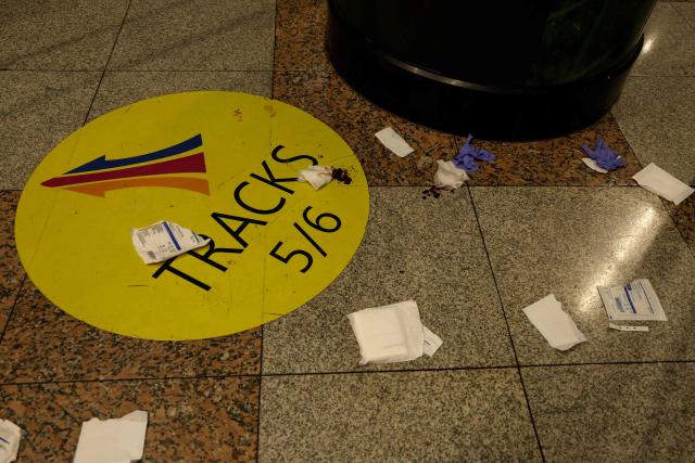 Gauze and gloves are seen on the floor at Penn Station after a stabbing incident in New York on June 7, 2026. Five people were wounded Sunday in a stabbing at New York's Penn Station, according to the city fire department, which said all victims were transported to hospital and the attacker was "in custody." The victims were all civilians, including one person with serious injuries, the New York Fire Department said in a statement. (Photo by John Lamparski / AFP)