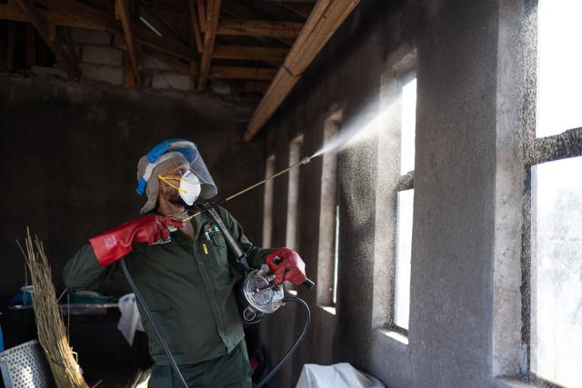 A Indoor Residual Spraying (IRS) technician prepares a fumigation apparatus before fumigating the property while another clears the space as part of a malaria elimination effort in Calcutta on May 25, 2026. Human-induced climate change, compounded by the La Nina weather pattern, has intensified extreme rainfall across southern Africa, the National Institute for Communicable Diseases (NICD) said, creating conditions that can fuel malaria transmission long after floodwaters recede.
In Mpumalanga, cases rose fourfold in January compared with a year earlier, jeopardising South Africa's goal of eliminating malaria by 2029. (Photo by EMMANUEL CROSET / AFP)