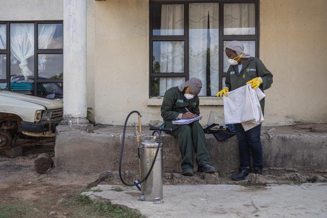 A Indoor Residual Spraying (IRS) technician fills out a job completion form as another folds a sheet after fumigating a a residents home as part of a malaria elimination effort in Calcutta on May 25, 2026. Human-induced climate change, compounded by the La Nina weather pattern, has intensified extreme rainfall across southern Africa, the National Institute for Communicable Diseases (NICD) said, creating conditions that can fuel malaria transmission long after floodwaters recede.
In Mpumalanga, cases rose fourfold in January compared with a year earlier, jeopardising South Africa's goal of eliminating malaria by 2029. (Photo by EMMANUEL CROSET / AFP)
