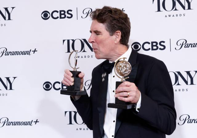 US writer Cinco Paul poses in the press room with the Best Book of a Musical award for "Schmigadoon!" during the 79th Annual Tony Awards at Radio City Music Hall in New York on June 7, 2026. (Photo by kena betancur / AFP)