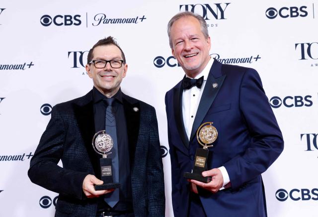 US orchestrators Doug Besterman (L) and Mike Morris (R) pose in the press room with the Best Orchestrations award for "Schmigadoon!" during the 79th Annual Tony Awards at Radio City Music Hall in New York on June 7, 2026. (Photo by kena betancur / AFP)