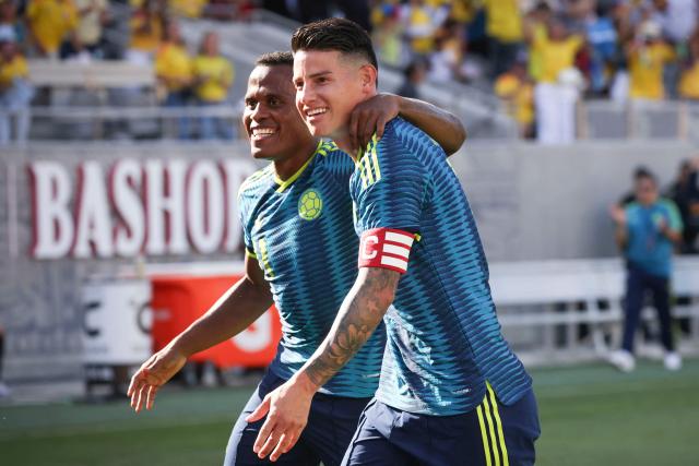 Colombia's midfielder #11 Jhon Arias celebrates with Colombia's midfielder #10 James Rodriguez after scoring a goal during the international friendly football match between Colombia and Jordan at Snapdragon Stadium in San Diego, California, on June 7, 2026. (Photo by SANDY HUFFAKER / AFP)