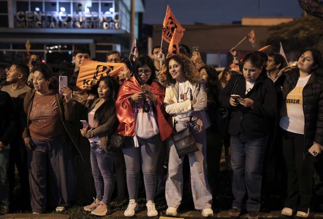 Supporters of Peru's presidential candidate Keiko Fujimori, for the Fuerza Popular party, stand outside her house following the first results of the presidential election runoff in Lima on June 7, 2026. Voting stations closed on June 7, 2026 in Peru's presidential election, with exit polls showing four-time candidate Keiko Fujimori with the slenderest of leads over her leftist rival Roberto Sanchez. (Photo by Anthony Nino de Guzman / AFP)