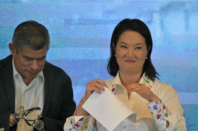 Peru's presidential candidate Keiko Fujimori, for the Fuerza Popular party, gestures as she gives a speech following the first results of the presidential election runoff in Lima on June 7, 2026. Voting stations closed on June 7, 2026 in Peru's presidential election, with exit polls showing four-time candidate Keiko Fujimori with the slenderest of leads over her leftist rival Roberto Sanchez. (Photo by MARTIN BERNETTI / AFP)
