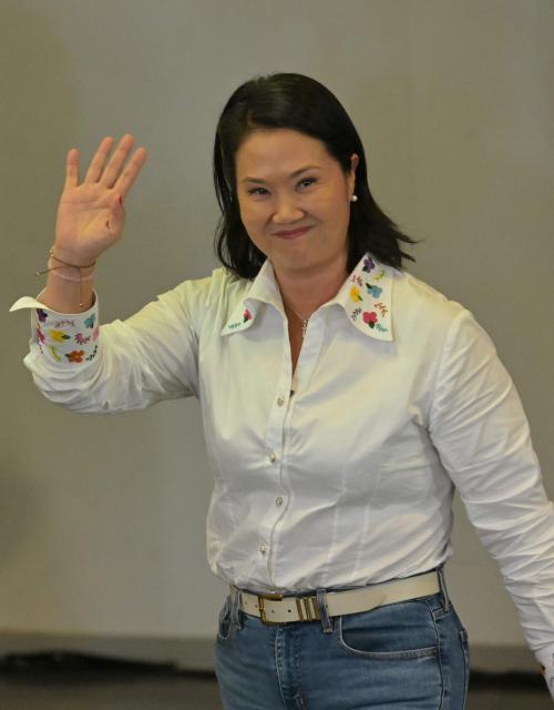 Peru's presidential candidate Keiko Fujimori, for the Fuerza Popular party, waves after a speech following the first results of the presidential election runoff in Lima on June 7, 2026. Voting stations closed on June 7, 2026 in Peru's presidential election, with exit polls showing four-time candidate Keiko Fujimori with the slenderest of leads over her leftist rival Roberto Sanchez. (Photo by MARTIN BERNETTI / AFP)