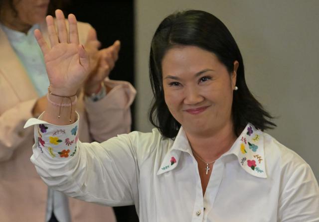 Peru's presidential candidate Keiko Fujimori, for the Fuerza Popular party, waves after a speech following the first results of the presidential election runoff in Lima on June 7, 2026. Voting stations closed on June 7, 2026 in Peru's presidential election, with exit polls showing four-time candidate Keiko Fujimori with the slenderest of leads over her leftist rival Roberto Sanchez. (Photo by MARTIN BERNETTI / AFP)