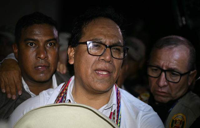 Peru's presidential candidate Roberto Sanchez, for the Juntos por el Peru party, gestures after a speech following the first results of the presidential election runoff in Lima on June 7, 2026. Voting stations closed on June 7, 2026 in Peru's presidential election, with exit polls showing four-time candidate Keiko Fujimori with the slenderest of leads over her leftist rival Roberto Sanchez. (Photo by ERNESTO BENAVIDES / AFP)