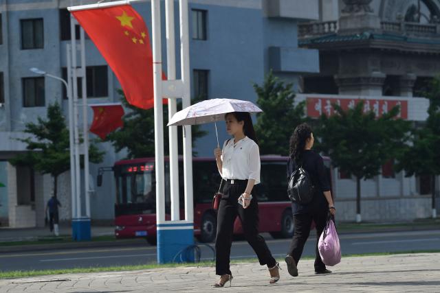 The national flag of China is displayed on a street in Pyongyang on June 8, 2026. Chinese President Xi Jinping arrived in Pyongyang on June 8, state news agency Xinhua reported, for his first official visit to North Korea since 2019. (Photo by KIM Won Jin / AFP)