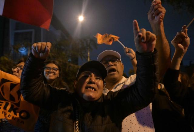 Supporters of Peru's presidential candidate Keiko Fujimori, for the Fuerza Popular party, react following the first results of the presidential election runoff in Lima on June 7, 2026. Voting stations closed on June 7, 2026 in Peru's presidential election, with exit polls showing four-time candidate Keiko Fujimori with the slenderest of leads over her leftist rival Roberto Sanchez. (Photo by MARTIN BERNETTI / AFP)