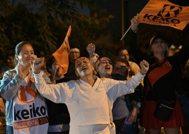 Supporters of Peru's presidential candidate Keiko Fujimori, for the Fuerza Popular party, react following the first results of the presidential election runoff in Lima on June 7, 2026. Voting stations closed on June 7, 2026 in Peru's presidential election, with exit polls showing four-time candidate Keiko Fujimori with the slenderest of leads over her leftist rival Roberto Sanchez. (Photo by MARTIN BERNETTI / AFP)