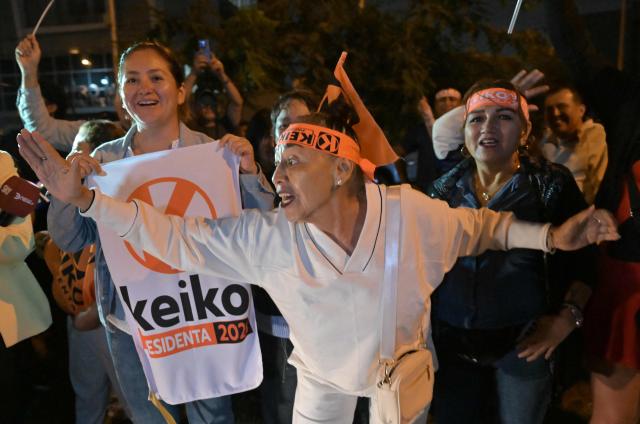 Supporters of Peru's presidential candidate Keiko Fujimori, for the Fuerza Popular party, react following the first results of the presidential election runoff in Lima on June 7, 2026. Voting stations closed on June 7, 2026 in Peru's presidential election, with exit polls showing four-time candidate Keiko Fujimori with the slenderest of leads over her leftist rival Roberto Sanchez. (Photo by MARTIN BERNETTI / AFP)