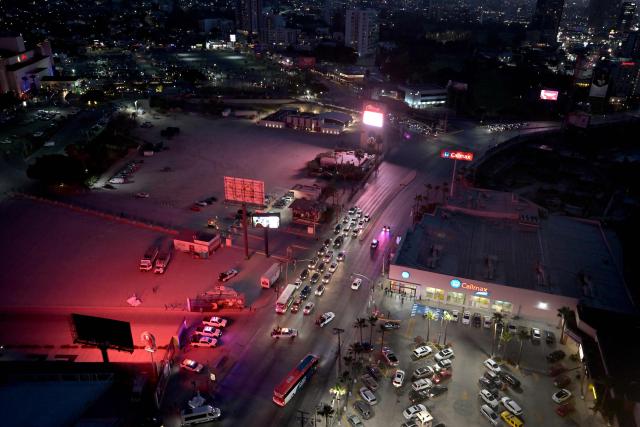 Aerial view of the bus transporting Iran's players surrounded by heavy security after a training session next to Caliente Stadium in Tijuana, Mexico on June 7, 2026, ahead of the FIFA 2026 World Cup. (Photo by Guillermo Arias / AFP)