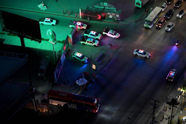 Aerial view of the bus transporting Iran's players surrounded by heavy security after a training session next to Caliente Stadium in Tijuana, Mexico on June 7, 2026, ahead of the FIFA 2026 World Cup. (Photo by Guillermo Arias / AFP)