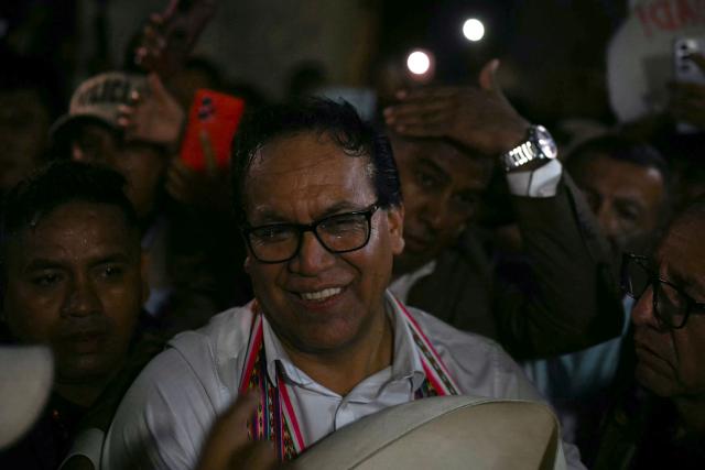 Peru's presidential candidate Roberto Sanchez, for the Juntos por el Peru party, smiles after a speech following the first results of the presidential election runoff in Lima on June 7, 2026. Voting stations closed on June 7, 2026 in Peru's presidential election, with exit polls showing four-time candidate Keiko Fujimori with the slenderest of leads over her leftist rival Roberto Sanchez. (Photo by ERNESTO BENAVIDES / AFP)