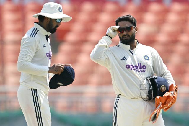 India's wicketkeeper Rishabh Pant (R) talks with teammate KL Rahul (L) during the third day of the only Test cricket match between India and Afghanistan at the Maharaja Yadavindra Singh International Cricket Stadium on the outskirts of Chandigarh on June 8, 2026. (Photo by Shammi MEHRA / AFP)