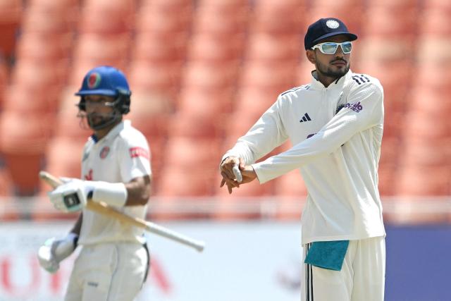 India's captain Shubhman Gill (R) stretches during the third day of the only Test cricket match between India and Afghanistan at the Maharaja Yadavindra Singh International Cricket Stadium on the outskirts of Chandigarh on June 8, 2026. (Photo by Shammi MEHRA / AFP)