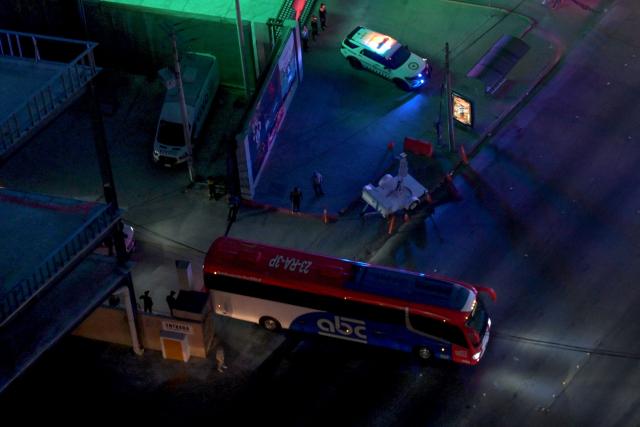 Aerial view of the bus transporting Iran's players surrounded by heavy security after a training session next to Caliente Stadium in Tijuana, Mexico on June 7, 2026, ahead of the FIFA 2026 World Cup. (Photo by Guillermo Arias / AFP)