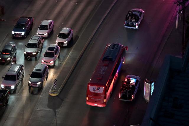 (FILES) Aerial view of the bus transporting Iran's players surrounded by heavy security after a training session in Tijuana, Mexico on June 7, 2026, ahead of the FIFA 2026 World Cup. (Photo by Guillermo Arias / AFP)