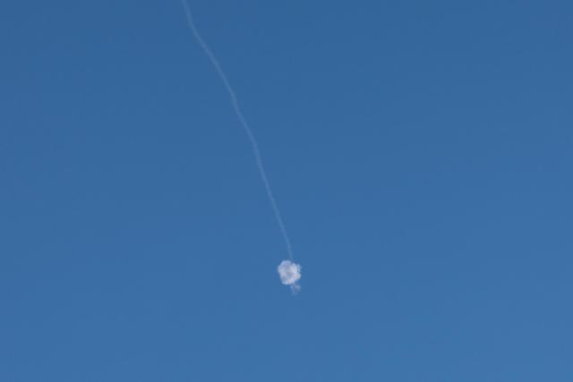 A trail of smoke from the interception of an Iranian attack is pictured over Jerusalem on June 8, 2026. Israel and Iran traded fire on June 8, seriously testing a fragile truce and threating hopes for a deal to end the Middle East war. (Photo by Ahmad GHARABLI / AFP)