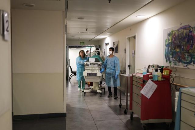 Hospital staff move a baby in an incubator to an underground facility for safety in Tel Aviv on June 8, 2026, after sirens sounded following Iranian attacks. Israel and Iran traded fire on June 8, seriously testing a fragile truce and threating hopes for a deal to end the Middle East war. (Photo by Ilia YEFIMOVICH / AFP)