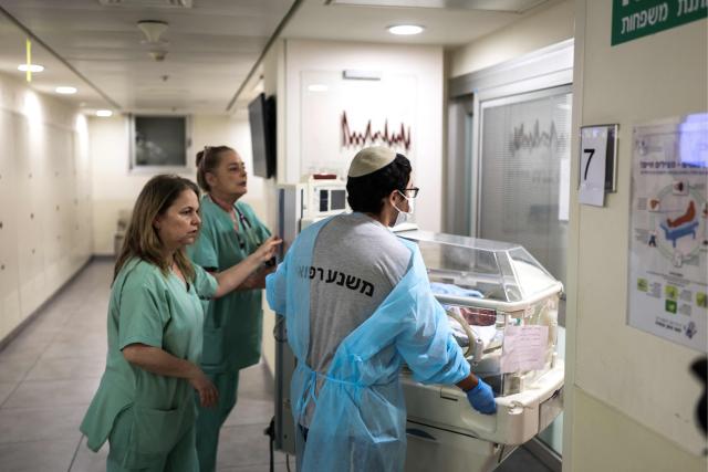 Hospital staff move a baby in an incubator to an underground facility for safety in Tel Aviv on June 8, 2026, after sirens sounded following Iranian attacks. Israel and Iran traded fire on June 8, seriously testing a fragile truce and threating hopes for a deal to end the Middle East war. (Photo by Ilia YEFIMOVICH / AFP)