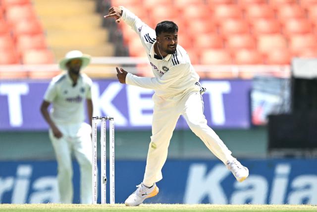 India's Manav Suthar delivers a ball during the third day of the only Test cricket match between India and Afghanistan at the Maharaja Yadavindra Singh International Cricket Stadium on the outskirts of Chandigarh on June 8, 2026. (Photo by Shammi MEHRA / AFP)