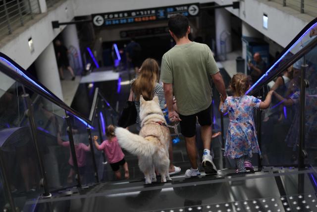 People use an escalator to take cover in a public shelter during a rocket attack alert in Tel Aviv on June 8, 2026. The Israeli military said on June 8 that it had detected a new barrage of missiles launched from Iran, the sixth salvo since the latest flare-up in fighting began the previous day. Israel and Iran traded fire on June 8, seriously testing a fragile truce and threating hopes for a deal to end the Middle East war. (Photo by Ilia YEFIMOVICH / AFP) / Attention editors: AFP covers the war in the Middle East through its extensive regional network, including bureaus in Tehran, Jerusalem, and several neighboring countries. Since the start of the conflict, journalists have been working under increasingly restrictive conditions. Authorities in several countries have limited reporters' movements, photo and live video coverage from sensitive locations. Some governments and armed groups have banned images of missile or drone strikes and other security-related sites. / 
