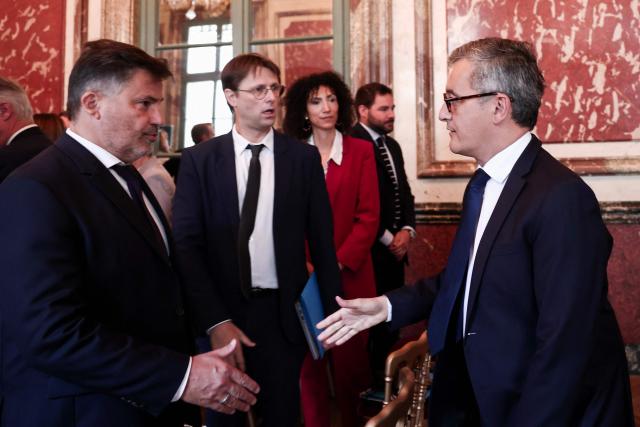 France's Justice Minister Gerald Darmanin (R) shakes hands with prosecutors during a working meeting with France's public prosecutors general to ask them for a review of complaints involving child victims in the wake of the Lyhanna case, while feminist and child protection groups called for demonstrations in front of courthouses at the Ministry of Justice in Paris, on June 8, 2026. Darmanin will tell them that they have until July 14, 2026 “to review all the complaints involving children,” around 70,000 in total, as the minister already announced on June 7, 2026 on LCI. (Photo by Behrouz MEHRI / POOL / AFP)