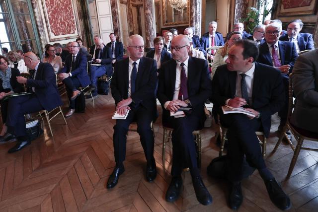 French supreme court prosecutor Remy Heitz (C) waits for the arrival of France's Justice Minister ahead of a working meeting with France's public prosecutors general to ask them for a review of complaints involving child victims in the wake of the Lyhanna case, while feminist and child protection groups called for demonstrations in front of courthouses at the Ministry of Justice in Paris, on June 8, 2026. Darmanin will tell them that they have until July 14, 2026 “to review all the complaints involving children,” around 70,000 in total, as the minister already announced on June 7, 2026 on LCI. (Photo by Behrouz MEHRI / POOL / AFP)