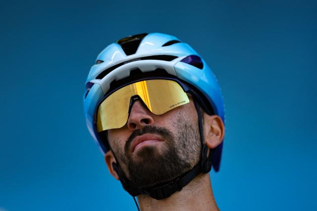 Soudal Quick-Step's French rider Valentin Paret Peintre awaits the start of the 2nd stage of the Tour Auvergne-Rhone-Alpes cycling race (formerly known as the Criterium du Dauphine), 134,3km between Saint-Martin-Le-Vinoux and Le Puy-en-Velay, in the French Alps, on June 8, 2026. (Photo by Anne-Christine POUJOULAT / AFP)